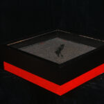 Black square display tray with red base