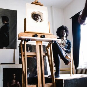 Artist studio with model seated near easel