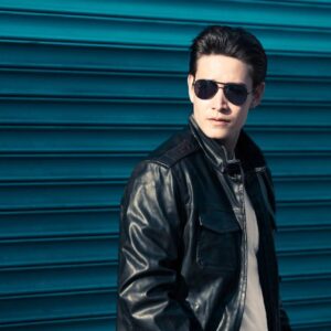 Man wearing leather jacket and sunglasses