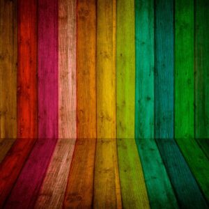 Rainbow-colored wooden planks reflected on floor